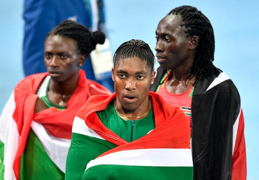 Burundi's silver medal winner Francine Niyonsaba, left, Kenya's bronze medal winner Margaret Wambui, right, and South Africa's gold medal winner Caster Semenya celebrate after the women's 800-meter final during the athletics competitions of the 2016 Summer Olympics at the Olympic stadium in Rio de Janeiro, Brazil, Saturday, Aug. 20, 2016. (AP Photo/Martin Meissner)