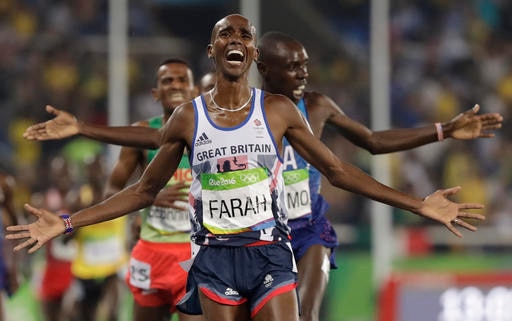 Britain's Mo Farah wins the gold medal in the men's 5000-meter final during the athletics competitions of the 2016 Summer Olympics at the Olympic stadium in Rio de Janeiro, Brazil, Saturday, Aug. 20, 2016. (AP Photo/David J. Phillip)