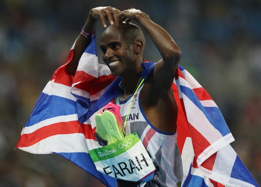 Britain's Mo farah celebrates winning the men's 5000-meter during athletics competitions at the Summer Olympics inside Olympic stadium in Rio de Janeiro, Brazil, Saturday, Aug. 20, 2016. (AP Photo/Lee Jin-man)