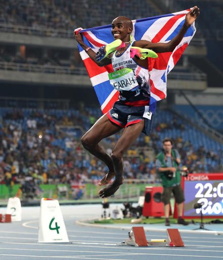 Britain's Mo farah celebrates winning the men's 5000-meter during athletics competitions at the Summer Olympics inside Olympic stadium in Rio de Janeiro, Brazil, Saturday, Aug. 20, 2016. (AP Photo/Lee Jin-man)