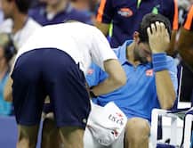 US Open: Novak Djokovic wins despite right arm trouble Jerzy Janowicz