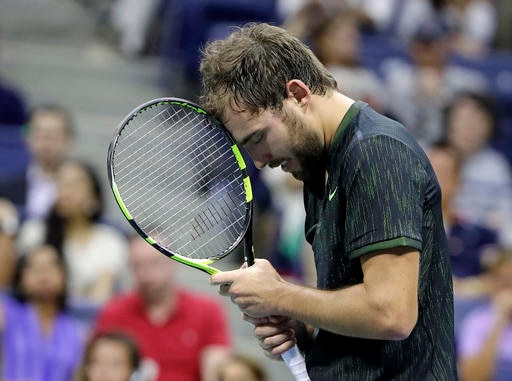 US Open: Novak Djokovic wins despite right arm trouble Jerzy Janowicz