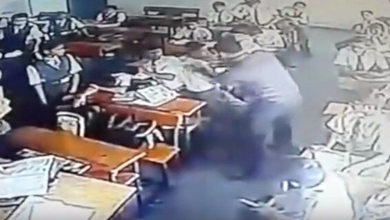 SHOCKING VIDEO: Teacher mercilessly kicks, slaps student for not doing homework SHOCKING VIDEO: Teacher mercilessly kicks, slaps student for not doing homework