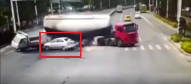 Horrific accident: Watch tanker loses control, crushing car on a crossroad Horrific accident: Watch tanker loses control, crushing car on a crossroad