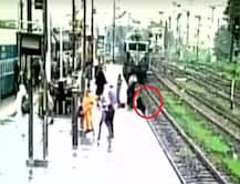 WATCH: Woman tries to cross railway track as speeding train approaches in Gujarat