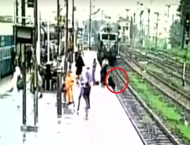 WATCH: Woman tries to cross railway track as speeding train approaches in Gujarat WATCH: Woman tries to cross railway track as speeding train approaches in Gujarat