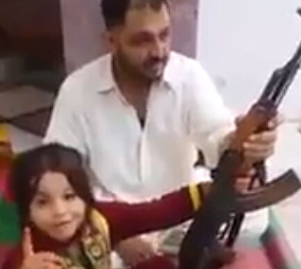 VIDEO: Pakistani father teaches little girl to fire AK-47 and threaten Narendra Modi VIDEO: Pakistani father teaches little girl to fire AK-47 and threaten Narendra Modi