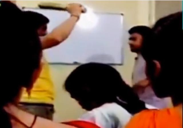 Caught on cam: Teacher brutally assaults male students; pull hairs, slaps females students Caught on cam: Teacher brutally assaults male students; pull hairs, slaps females students