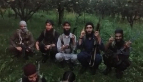 Jammu and Kashmir: New video shows Hizbul, Lashkar, JeM militants brandishing snatched police rifles Jammu and Kashmir: New video shows Hizbul, Lashkar, JeM militants brandishing snatched police rifles