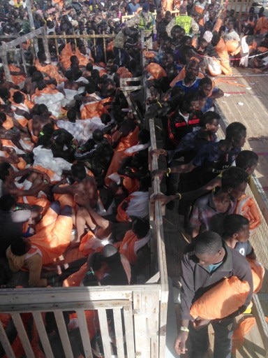 Boat with 1,100 migrants, 17 corpses reaches Italy Boat with 1,100 migrants, 17 corpses reaches Italy