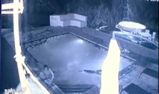Crocodile attacks couple swimming in hotel pool in terrifying footage Crocodile attacks couple swimming in hotel pool in terrifying footage