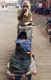 Telangana: Unable to afford an ambulance, man carries wife's body on pushcart for 60 kms