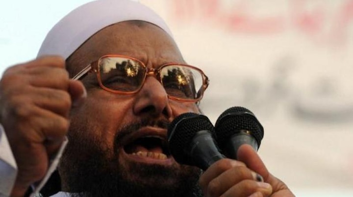 Pakistan bans Saeed from travelling, protests escalate Pakistan bans Saeed from travelling, protests escalate