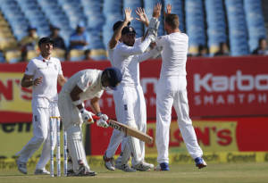 England's cricketers celebrate the wicket of Indian batsman, Gautam Gambhir (AP Photo)