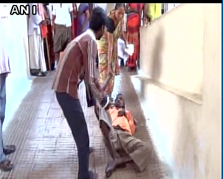 In Pics: Wife drags ailing husband to first floor after hospital denies stretcher