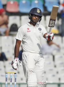 India's Jayant Yadav acknowledges the crowd scoring fifty runs on their third cricket test match against England in Mohali, India, Monday, Nov. 28, 2016. (AP Photo/Altaf Qadri)