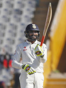 India's Ravindra Jadeja celebrates after scoring a half century on the third day of their third cricket test match against England in Mohali, India, Monday, Nov. 28, 2016. (AP Photo/Altaf Qadri)