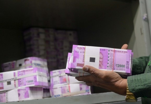 Amid cash crunch, I-T dept seizes over Rs 4 cr cash in new currency in Bengaluru Amid cash crunch, I-T dept seizes over Rs 4 cr cash in new currency in Bengaluru