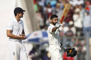 England's captain Alastair Cook left, applauds as Indian cricket captain Virat Kohli celebrates after scoring a hundred, photo: AP 