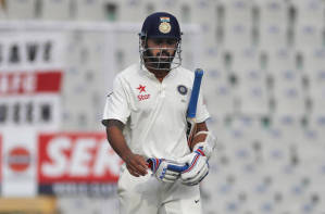 India's Murali Vijay walks back to the pavilion after being dismissed on the third day of the fourth Test cricket test match against England (AP PHOTO)