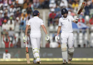 England's batsman Joe Root raises his bat after scoring 50 runs (AP PHOTO)