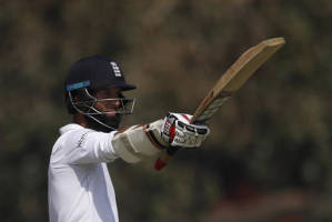 England's Moeen Ali raises his bats after scoring half century during their first day of the fifth cricket test match against India (AP PHOTO)