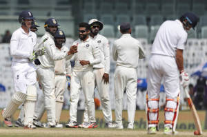 England's Keaton Jennings, left, leaves the ground after being dismissed by India's Ravindra Jadeja, fourth right, during their fifth day of the fifth cricket test match in Chennai.