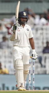 India's Parthiv Patel raises his bat after scoring half century against England during their third day of the fifth cricket test match in Chennai (AP Photo)