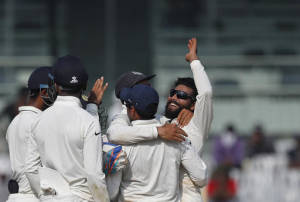 India's Ravindra Jadeja, right, and teammates celebrate the dismissal of England's Ben Stokes 2016. (AP Photo/Tsering Topgyal)
