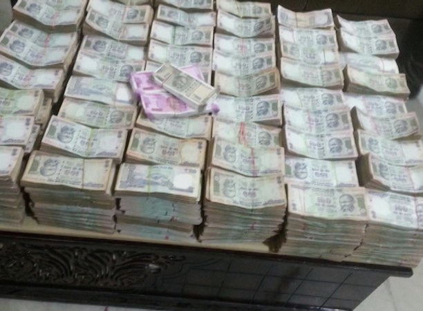 Rs 58 lakh cash and foreign currency including US dollars seized from 'hing' trader in Punjab Rs 58 lakh cash and foreign currency including US dollars seized from 'hing' trader in Punjab