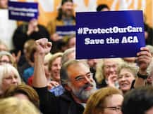 Donald Trump era begins with Obamacare rollback, protests