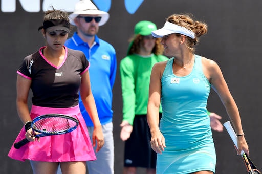Australian Open: Paes off to winning start, Sania loses in women's doubles Australian Open: Paes off to winning start, Sania loses in women's doubles