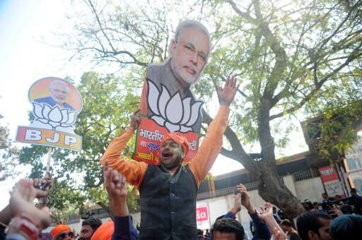 Election officials said the BJP began taking strong leads right from the start of the counting and it became clear within an hour that it was set to comfortably take power in Uttar Pradesh. PIC/AFP.