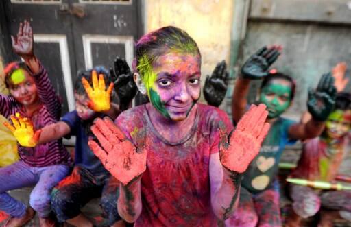 Indian revellers play with colours during Holi celebrations in Chennai on March 13, 2017. The Hindu festival of Holi, or the 'Festival of Colours' heralds the arrival of spring and the end of winter. / AFP PHOTO / ARUN SANKAR