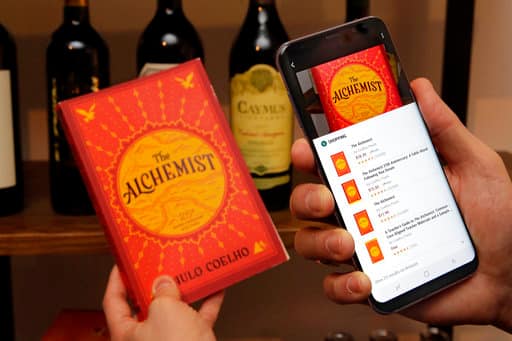 In this Friday, March 24, 2017, photo, the Bixby function of the new Samsung Galaxy S8 Plus is demonstrated in New York. The Galaxy S8 features a larger display than its predecessor, the Galaxy S7, and sports a voice assistant intended to rival Siri and Google Assistant. (AP Photo/Richard Drew)