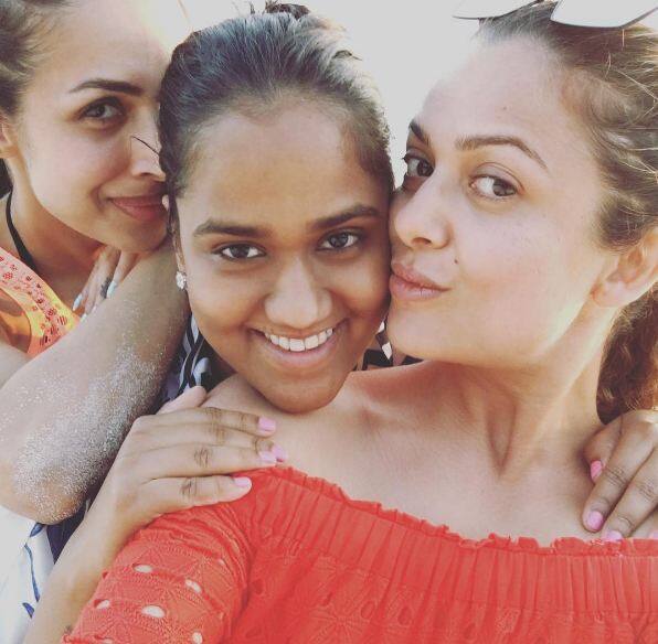 Amrita Arora Khan is also having great time with the family. She looks beautiful as she poses with B'day boy's mom and her sister Malaika. (PC: Instagram/amuaroraofficial