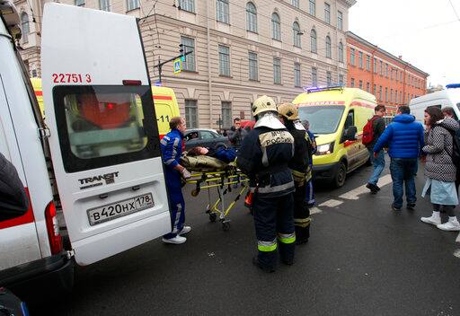 People carry a subway blast victim into an ambulance after explosion at Tekhnologichesky Institut subway station in St.Petersburg, Russia, Monday, April 3, 2017. The subway in the Russian city of St. Petersburg is reporting that there are fatalities and several people have been injured in an explosion on a subway train. (Alexander Tarasenkov/Interpress via AP)