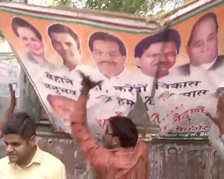 MCD polls: Upset over ticket distribution, Congress supporters tear Maken's posters  MCD polls: Upset over ticket distribution, Congress supporters tear Maken's posters