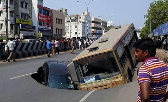 Major cave-in on Chennai road swallows vehicles Major cave-in on Chennai road swallows vehicles