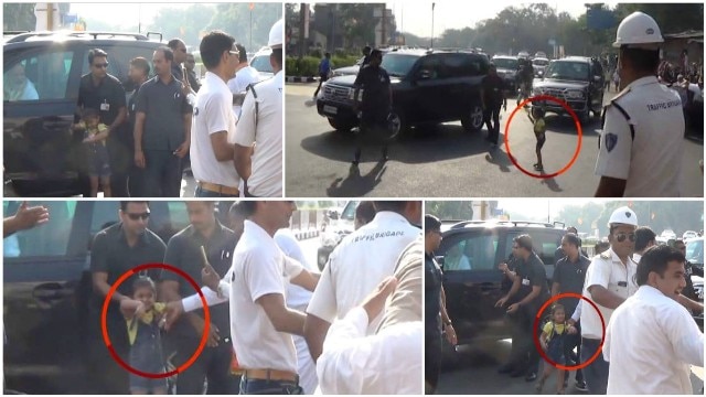 Surat: Narendra Modi stops his cavalcade midway to meet a small girl, embraces the child Surat: Narendra Modi stops his cavalcade midway to meet a small girl, embraces the child