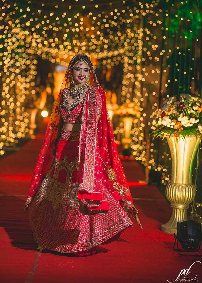 Popular TV actress Pooja Banerjee is currently enjoying marital bliss as she got married to National Swimmer, Sandeep Sejwal on February 28. Actress was looking stunning as a bride as she wore red lehenga with golden jewelry. (Image Courtesy – PurushottamDebPhotoworks)