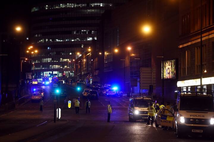 Police deploy at scene of explosion in Manchester, England, on May 23, 2017. PIC/AFP.