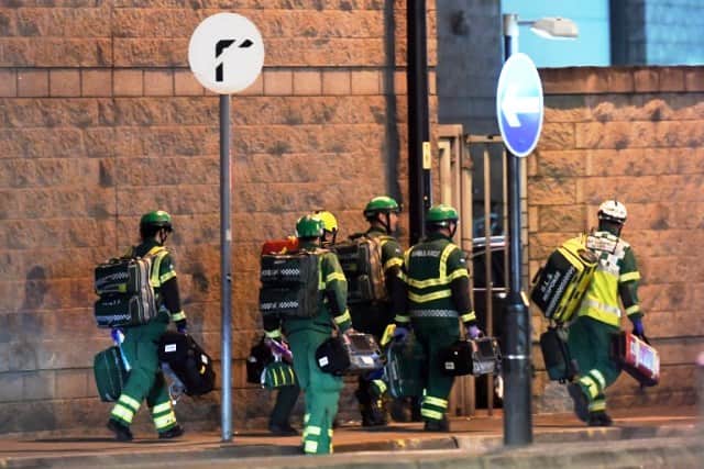 Medics deploy at the scene of a reported explosion. PIC/AFP.