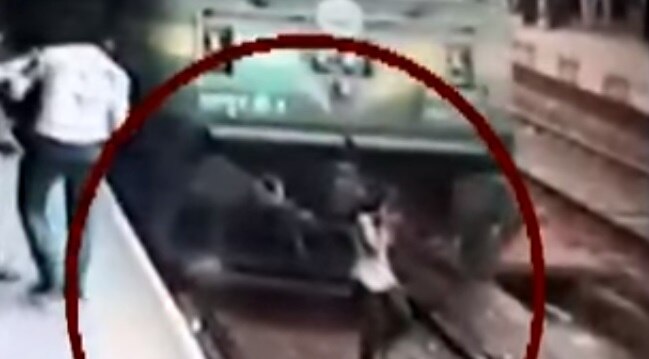 WATCH: Mumbai girl miraculously escapes death after coming under a running train WATCH: Mumbai girl miraculously escapes death after coming under a running train