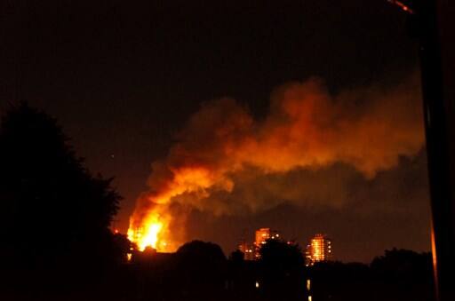 Forty fire engines and 200 firefighters and officers have been called to the scene. PIC/AFP.
