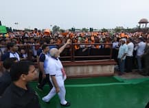 PM Modi performs asanas amid rain, says yoga connecting world with India