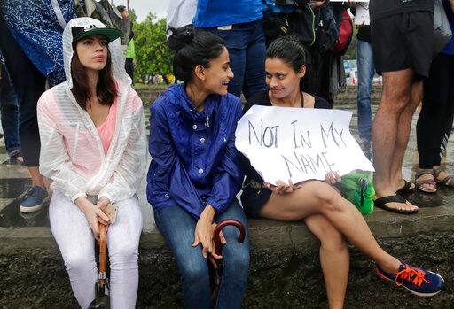 Bollywood actress Kalki Koechlin, left, sits with others during the protest in Mumbai. PIC/AP.