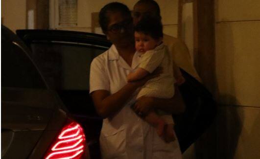 Kareena Kapoor and Saif Ali Khan's son Taimur Ali Khan has been spotted enjoying at his home and its not his mom who is holding him.