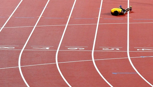 Bolt pulls up injured, fails to finish farewell race Bolt pulls up injured, fails to finish farewell race
