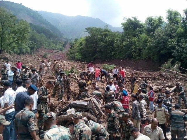 Locals told the administration that they vacated their homes and ran towards the forest area minutes before the entire mountain dislocated and slid down. (Photo: AFP)